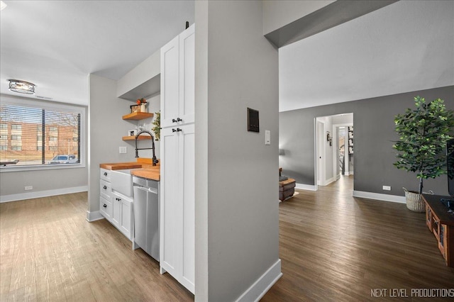 hall with sink and dark hardwood / wood-style flooring