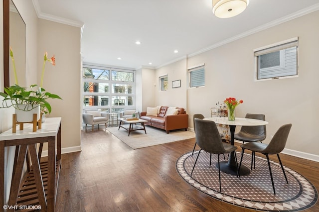 dining space featuring crown molding and hardwood / wood-style floors