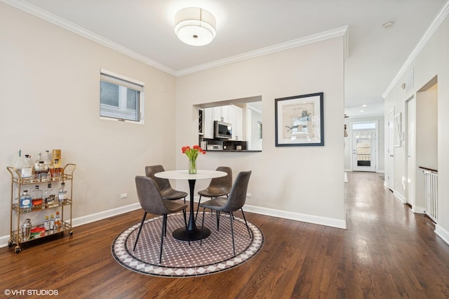 dining space with crown molding and dark hardwood / wood-style floors