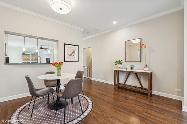 dining space featuring crown molding and dark wood-type flooring