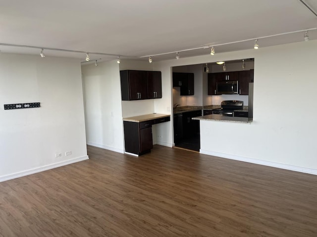 kitchen with sink, dark hardwood / wood-style floors, black range with electric cooktop, and dark brown cabinets