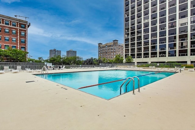 view of swimming pool with a patio