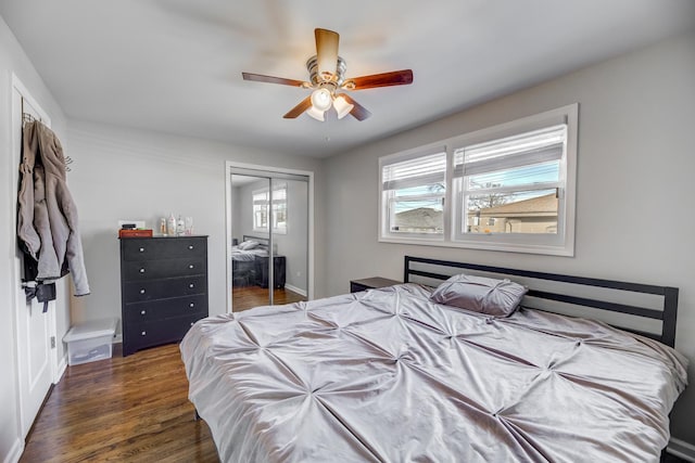 bedroom featuring ceiling fan, a closet, and wood finished floors