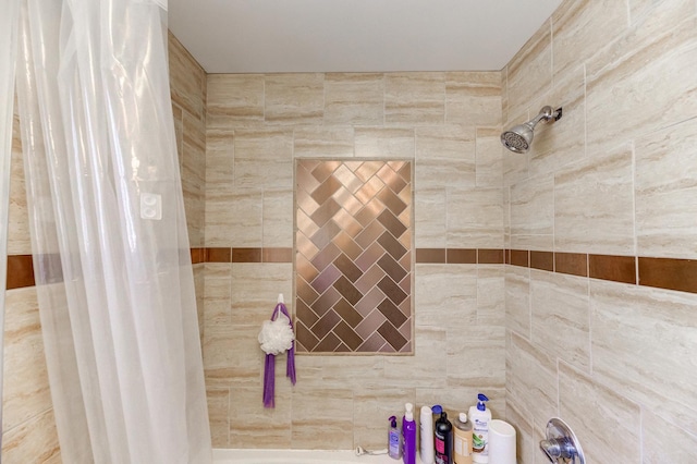 bathroom with tiled shower