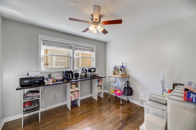 office featuring a ceiling fan, baseboards, and wood finished floors