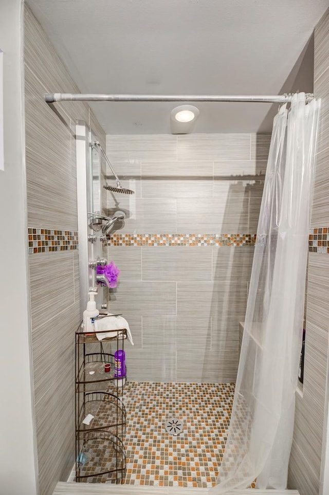 full bath with a shower stall