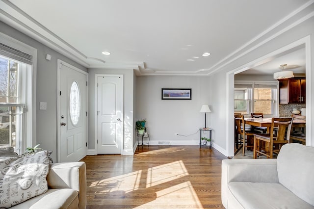 foyer featuring recessed lighting, wood finished floors, and baseboards