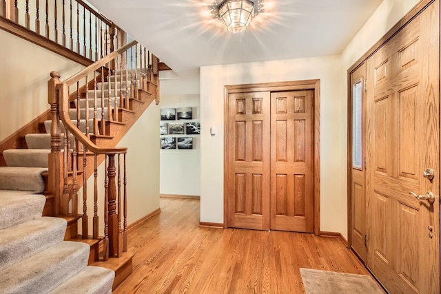 entrance foyer with light hardwood / wood-style floors