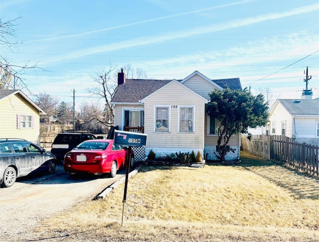 bungalow with a front yard