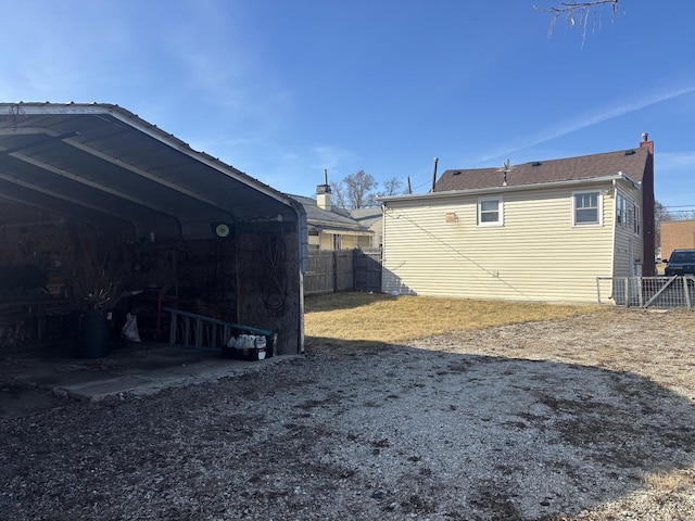 exterior space with a carport