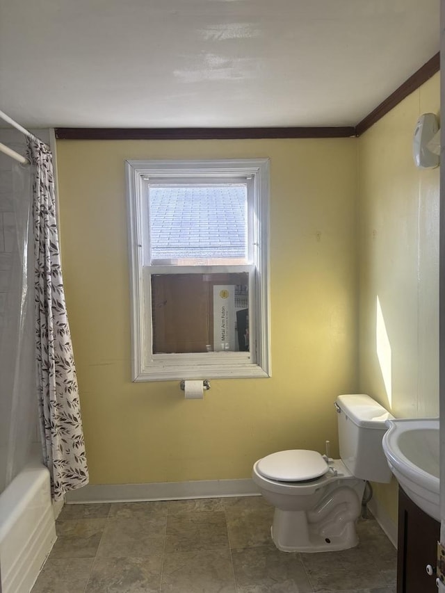 full bathroom with shower / tub combo with curtain, sink, and toilet