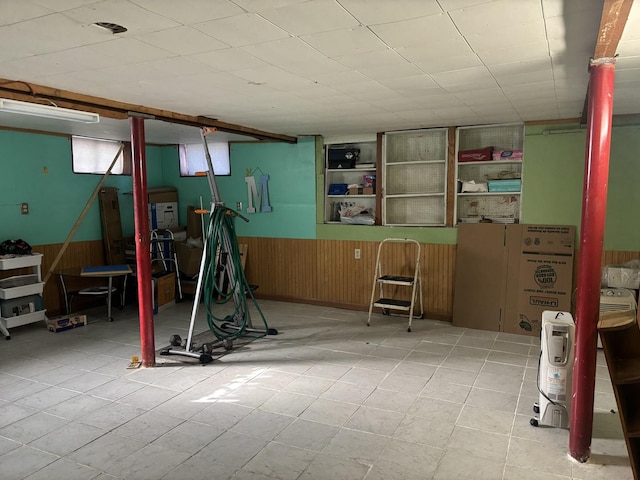 workout room featuring wood walls