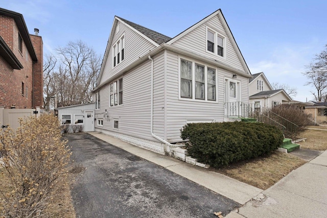 view of home's exterior with an outbuilding and a garage