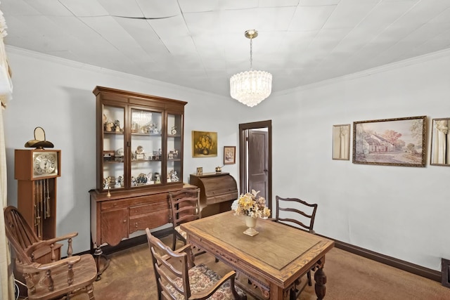 carpeted dining room featuring ornamental molding and a chandelier