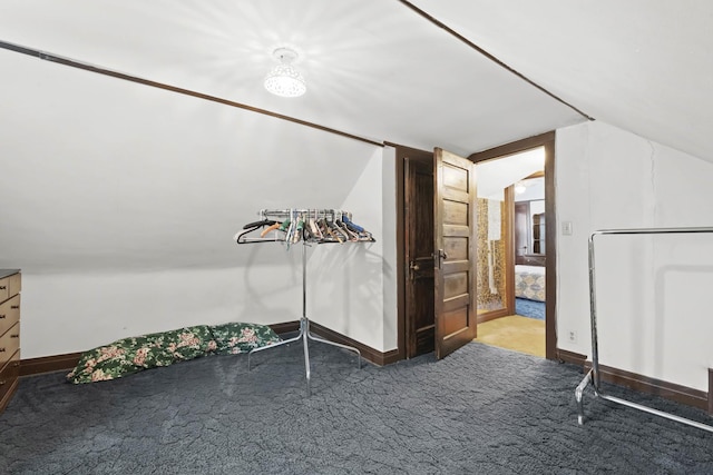 carpeted bedroom featuring vaulted ceiling