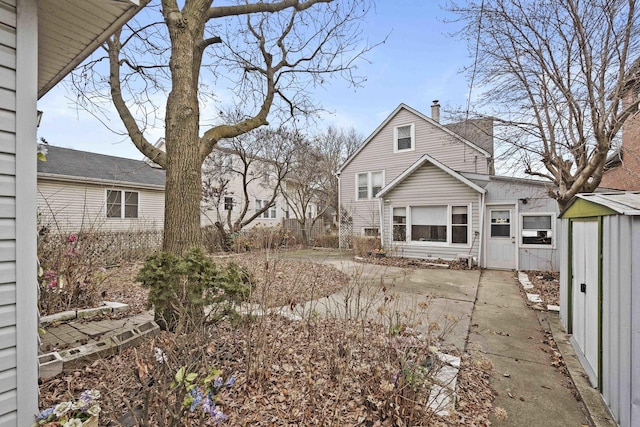 back of house with a patio area