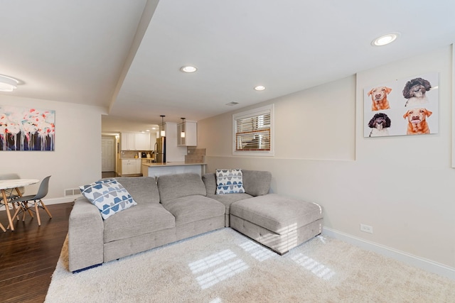 living room with dark hardwood / wood-style floors