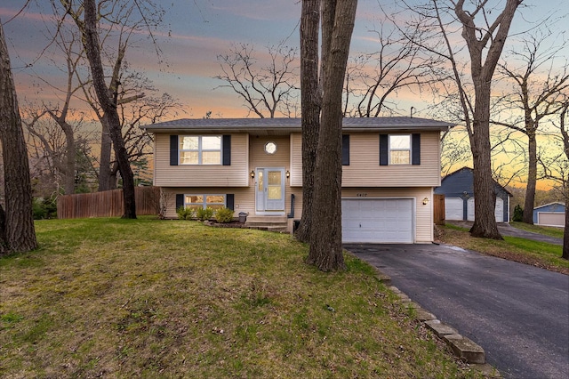 6402 N Shore Ave, Spring Grove, IL 60081 - bi-level home with asphalt driveway and a garage