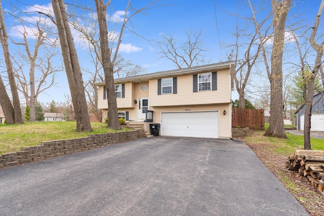 6402 N Shore Ave, Spring Grove, IL 60081 - split foyer home featuring asphalt driveway and a garage