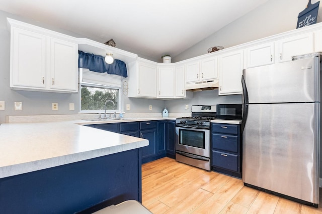 6402 N Shore Ave, Spring Grove, IL 60081 - kitchen featuring appliances with stainless steel finishes, blue cabinets, a sink, under cabinet range hood, and white cabinetry