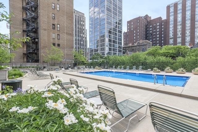 community pool featuring central AC, fence, a city view, and a patio