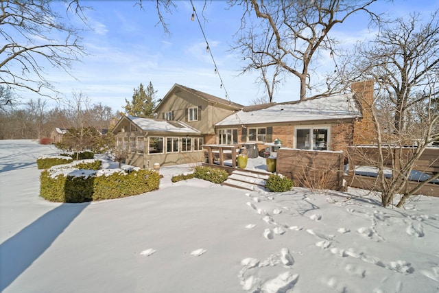 view of front of property featuring a sunroom