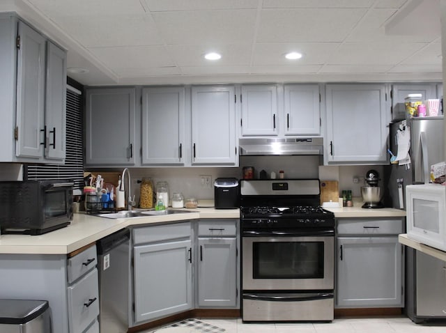 kitchen with gray cabinets, appliances with stainless steel finishes, and sink