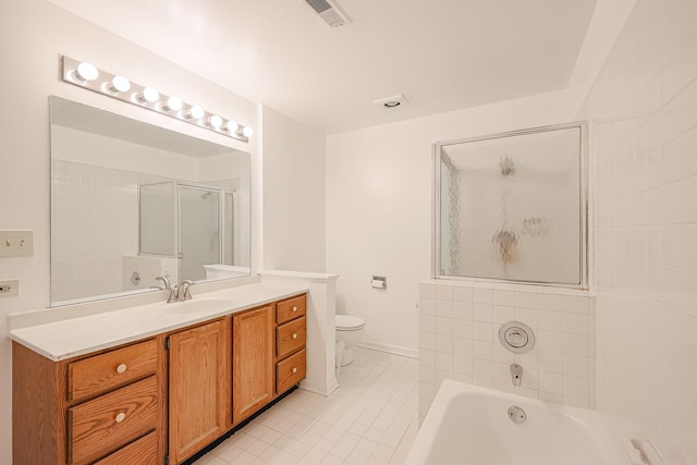 full bathroom featuring tile patterned floors, vanity, toilet, and shower with separate bathtub