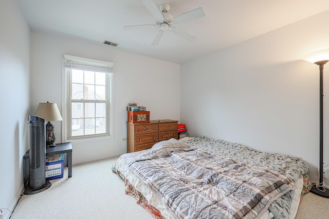 bedroom featuring light carpet and ceiling fan