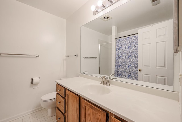 bathroom with tile patterned flooring, vanity, walk in shower, and toilet