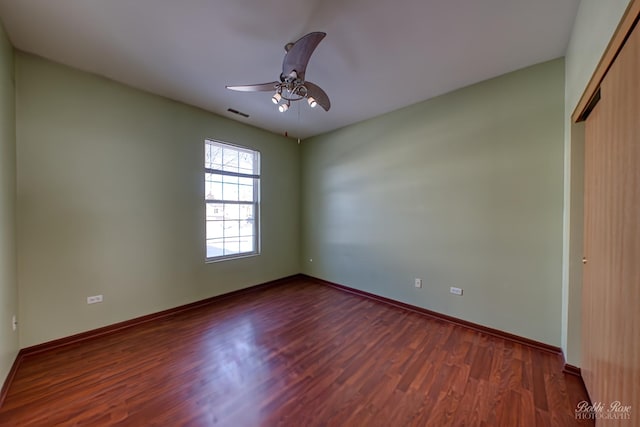 unfurnished bedroom with visible vents, a ceiling fan, baseboards, a closet, and dark wood finished floors