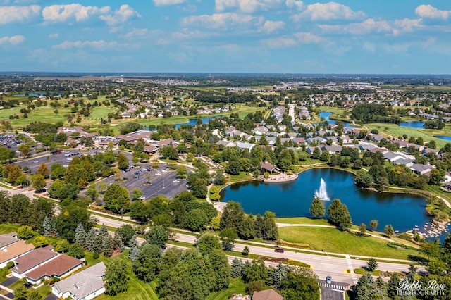 birds eye view of property with a water view and a residential view