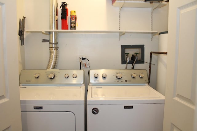 laundry room featuring separate washer and dryer