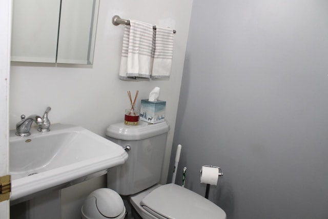 bathroom with toilet and sink