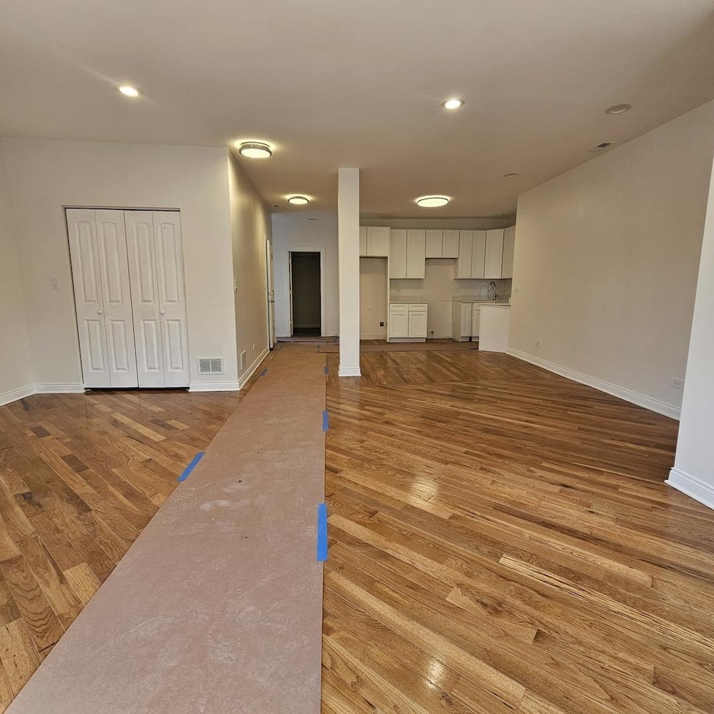 unfurnished living room featuring light hardwood / wood-style flooring