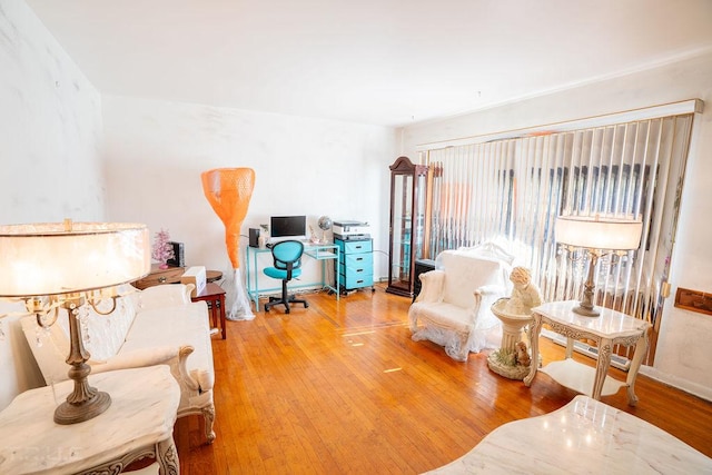 living area with hardwood / wood-style floors