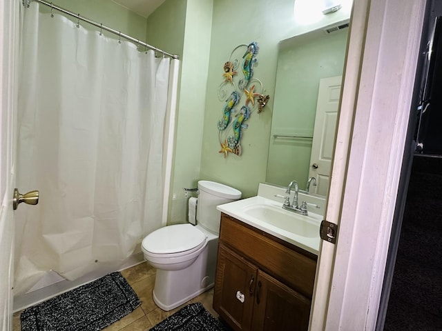 bathroom with a shower with curtain, vanity, tile patterned floors, and toilet