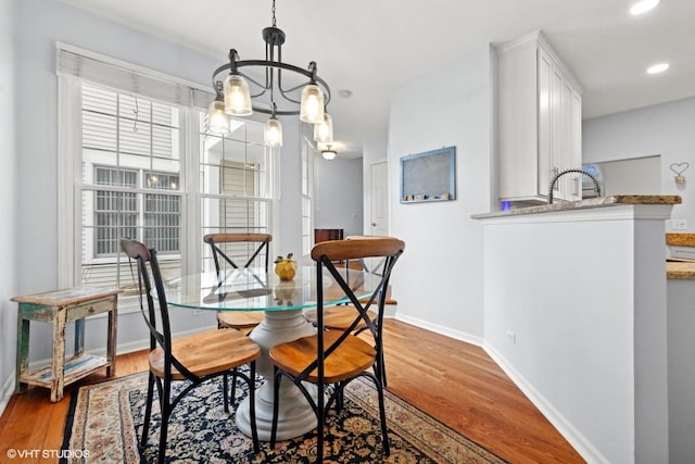 dining space featuring hardwood / wood-style flooring