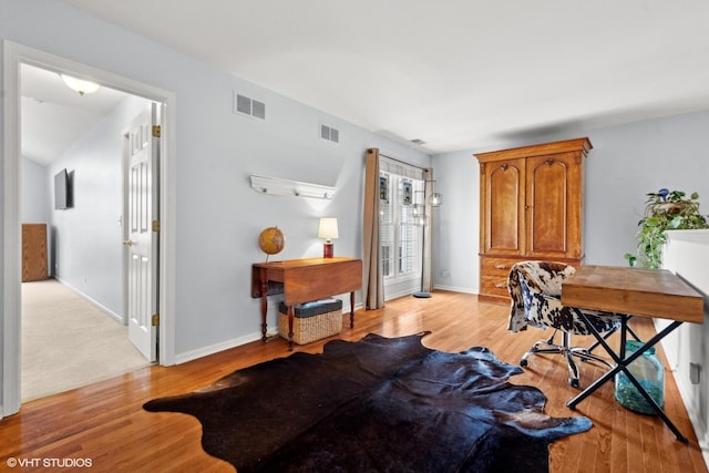 office space with light hardwood / wood-style flooring