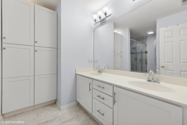 bathroom featuring vanity and a shower with shower door