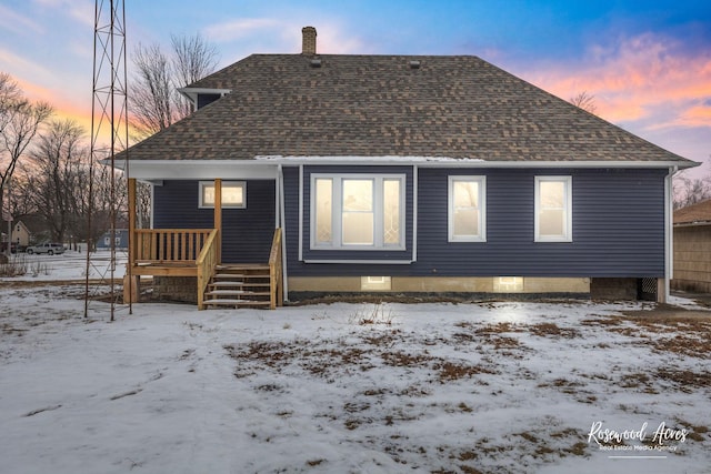 view of snow covered house