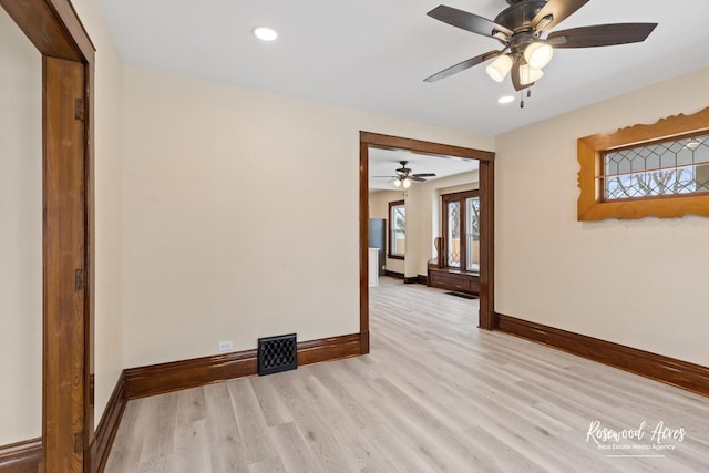 spare room with light wood-type flooring