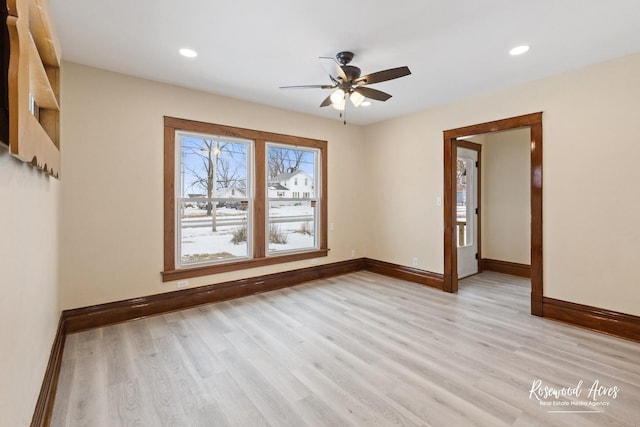 empty room featuring light wood-type flooring and ceiling fan