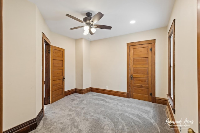 unfurnished bedroom featuring carpet and ceiling fan