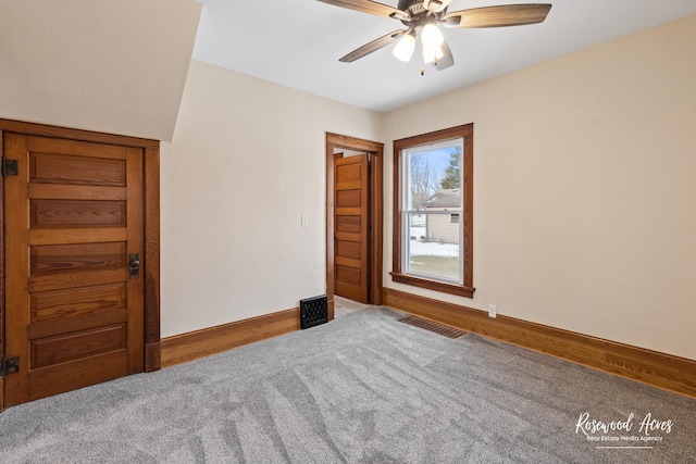 spare room with carpet and ceiling fan