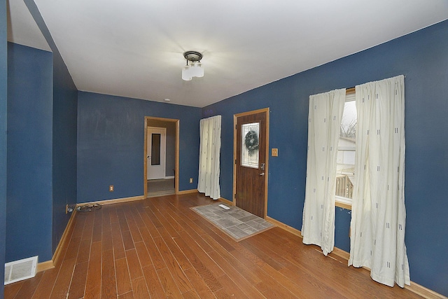 entryway with dark wood-type flooring