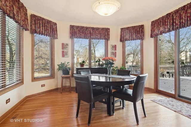 dining area featuring light wood-type flooring