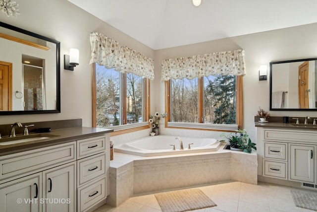 bathroom featuring vanity, tile patterned floors, and independent shower and bath