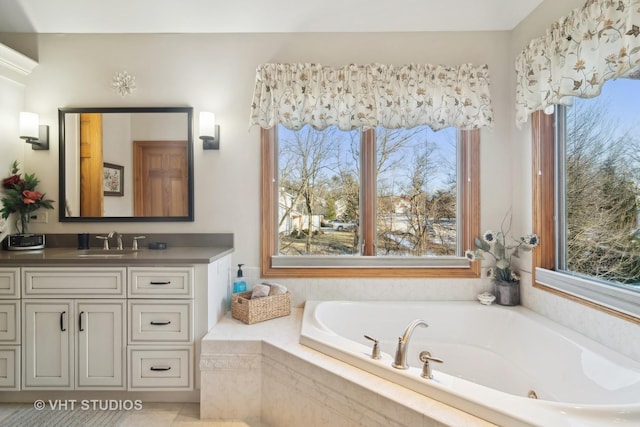 bathroom with a relaxing tiled tub and vanity