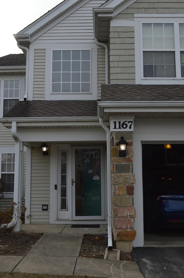 entrance to property featuring a garage